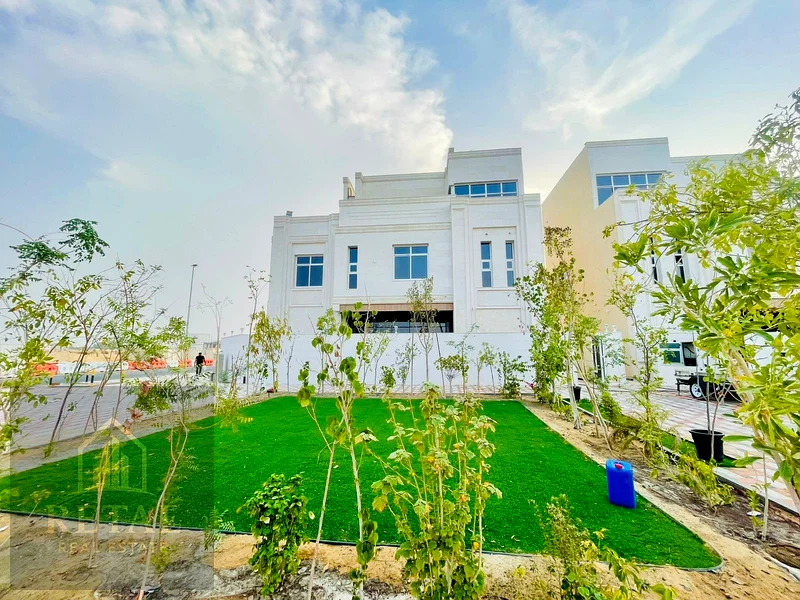 Luxury villa for sale in Al Helio Center Ajman on a prime corner location with private pool, garden, spacious layout, and full ownership services63906124026498110