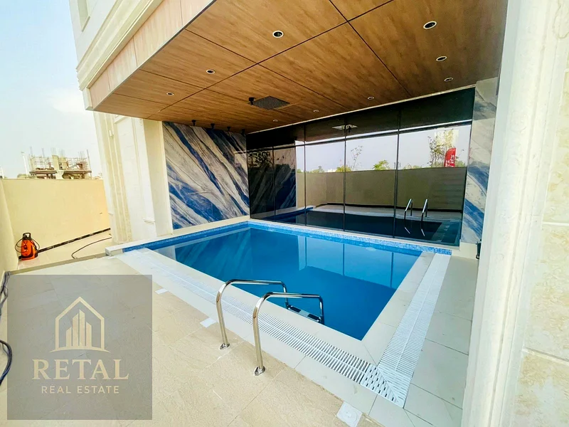 Luxury villa for sale in Al Helio Center Ajman on a prime corner location with private pool, garden, spacious layout, and full ownership services63906124026498113
