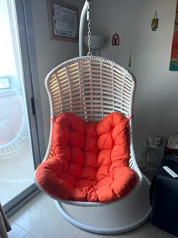 Chic Hanging Lounge Chair with Orange Cushions