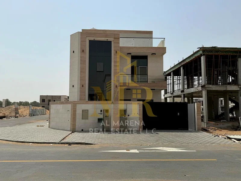 For sale, a corner villa in Al Hiliyo 2 - Ajman, two floors and a roof in a prime location with excellent space. Includes registration and ownership f63906123979395110