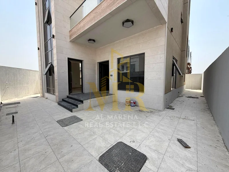 For sale, a corner villa in Al Hiliyo 2 - Ajman, two floors and a roof in a prime location with excellent space. Includes registration and ownership f63906123979395112