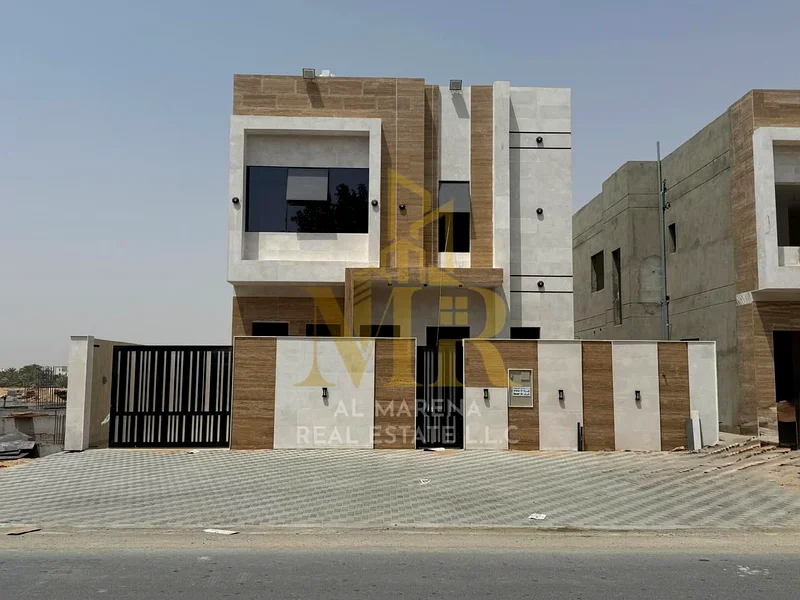 A villa at a price that includes registration and ownership fees on the main street, ready for living in the finest areas of Ajman, freehold ownership63906123987203110