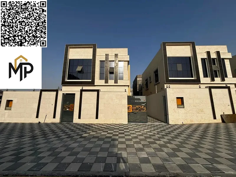 For sale, a luxurious villa in Al Helio, Ajman, 5 master bedrooms, a living room, and a hall, located in a strategic location near Mohammed bin Zayed63907043796227110