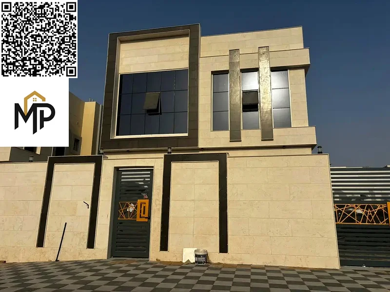 For sale, a luxurious villa in Al Helio, Ajman, 5 master bedrooms, a living room, and a hall, located in a strategic location near Mohammed bin Zayed63907043796227111