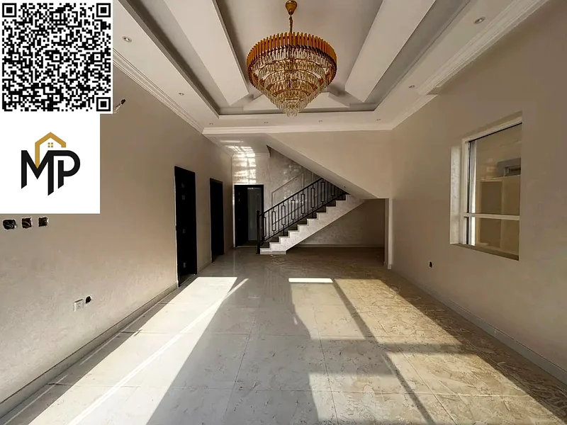 For sale, a luxurious villa in Al Helio, Ajman, 5 master bedrooms, a living room, and a hall, located in a strategic location near Mohammed bin Zayed63907043796227114