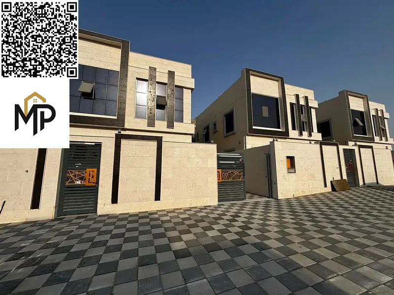For sale, a luxurious villa in Al Helio, Ajman, 5 master bedrooms, a living room, and a hall, located in a strategic location near Mohammed bin Zayed63907043796227112