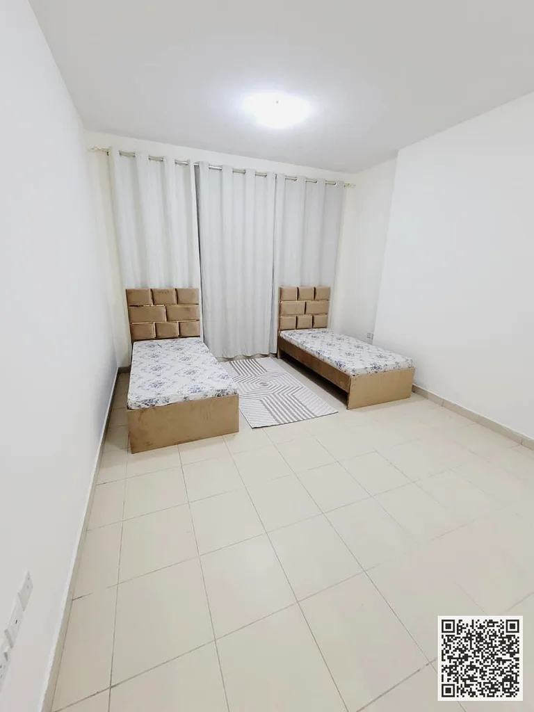شقة مفروشة من غرفتي نوم للإيجار الشهري 🏡 في عجمان، منطقة البستان، مقابل لولو ✔️ تشمل الفواتير والإنترنت ⚡ 📶 موقف خاص63836873768450113