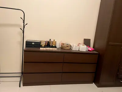 Elegant and Spacious Brown Dresser with Multiple Drawers