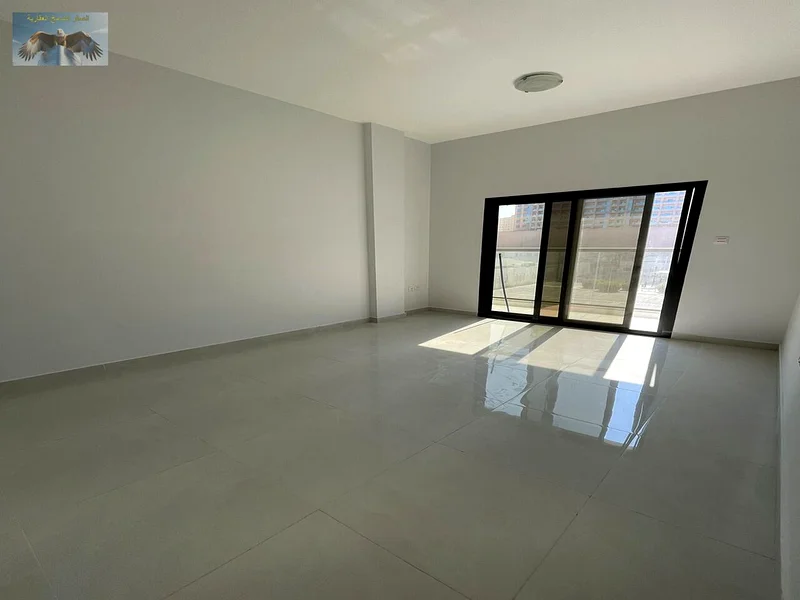 First tenant, two rooms and a hall with a balcony overlooking the main street, a large area for annual rent in Al Rawda 3 in Ajman63723377450883110