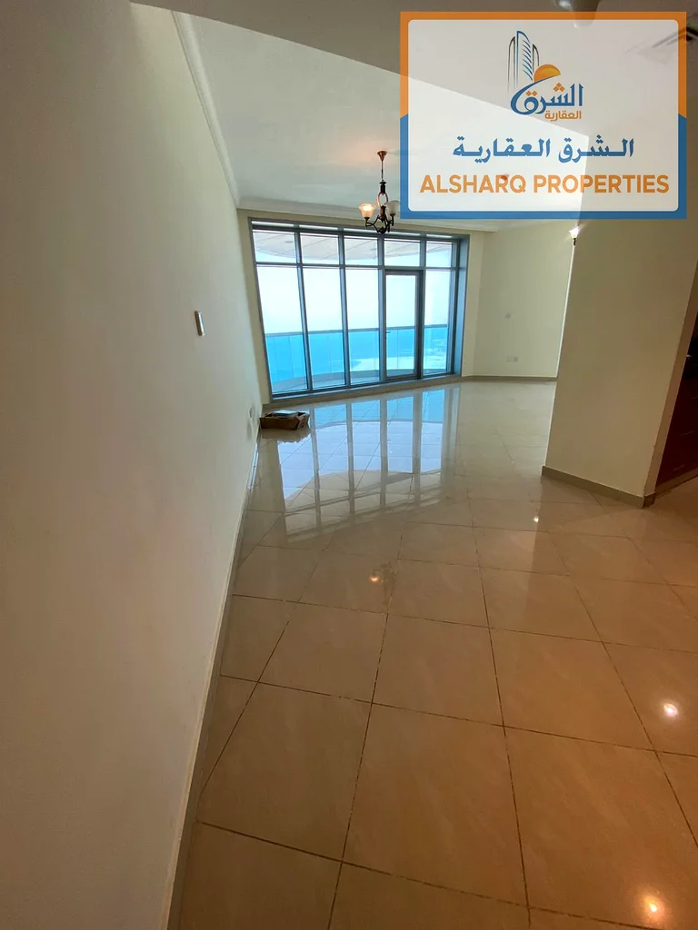 Rent a luxurious two-bedroom apartment with a gym, parking, and a swimming pool with a direct view of the Ajman Sea63810632290179112