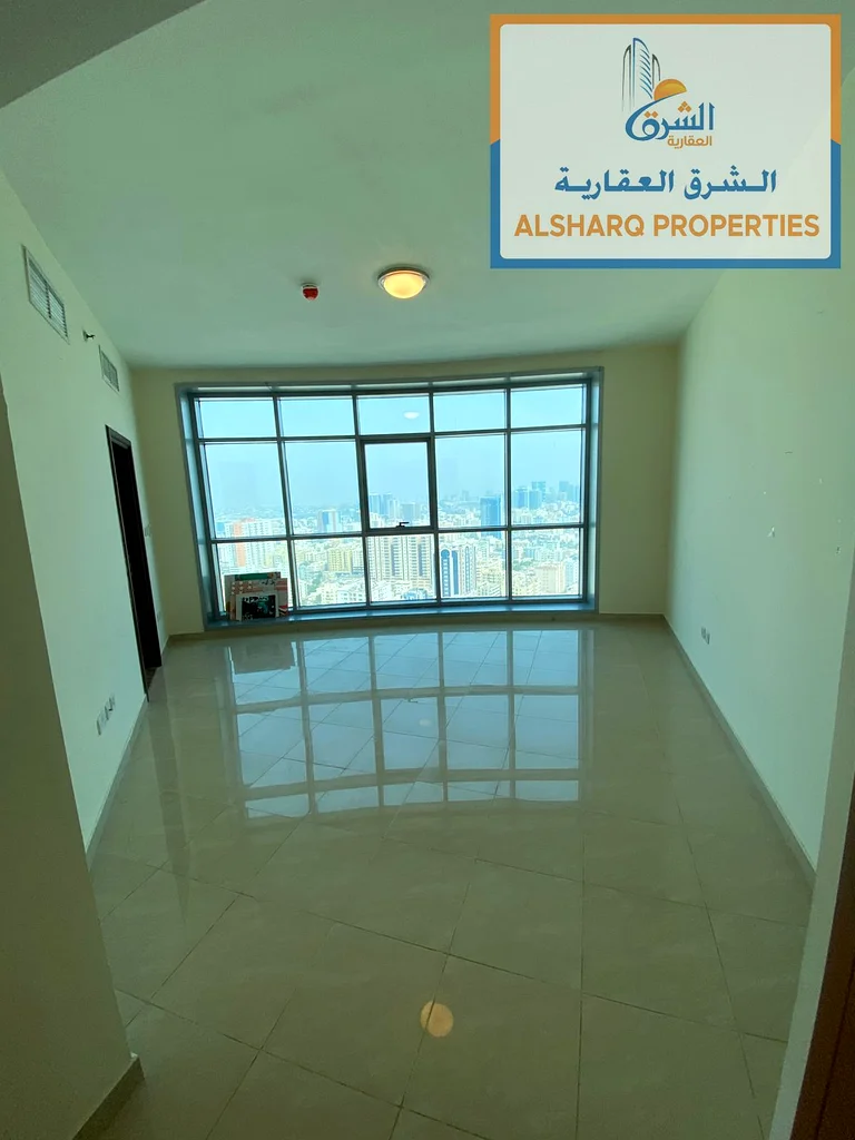 Rent a luxurious two-bedroom apartment with a gym, parking, and a swimming pool with a direct view of the Ajman Sea63810632290179111