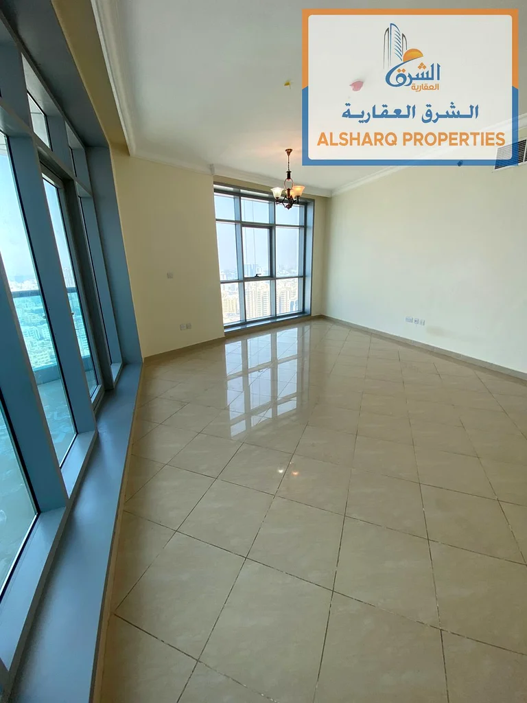 Rent a luxurious two-bedroom apartment with a gym, parking, and a swimming pool with a direct view of the Ajman Sea63810632290179113
