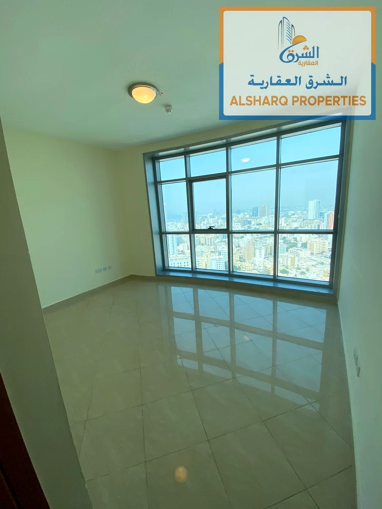 Rent a luxurious two-bedroom apartment with a gym, parking, and a swimming pool with a direct view of the Ajman Sea63810632290179114