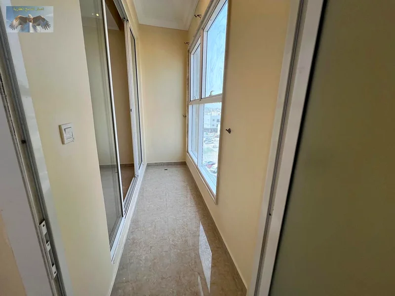 For rent in Ajman, a spacious family apartment, 3 rooms and a hall with a store and a balcony in Al Rawda 3, a vital location close to services and fr63721798019203112