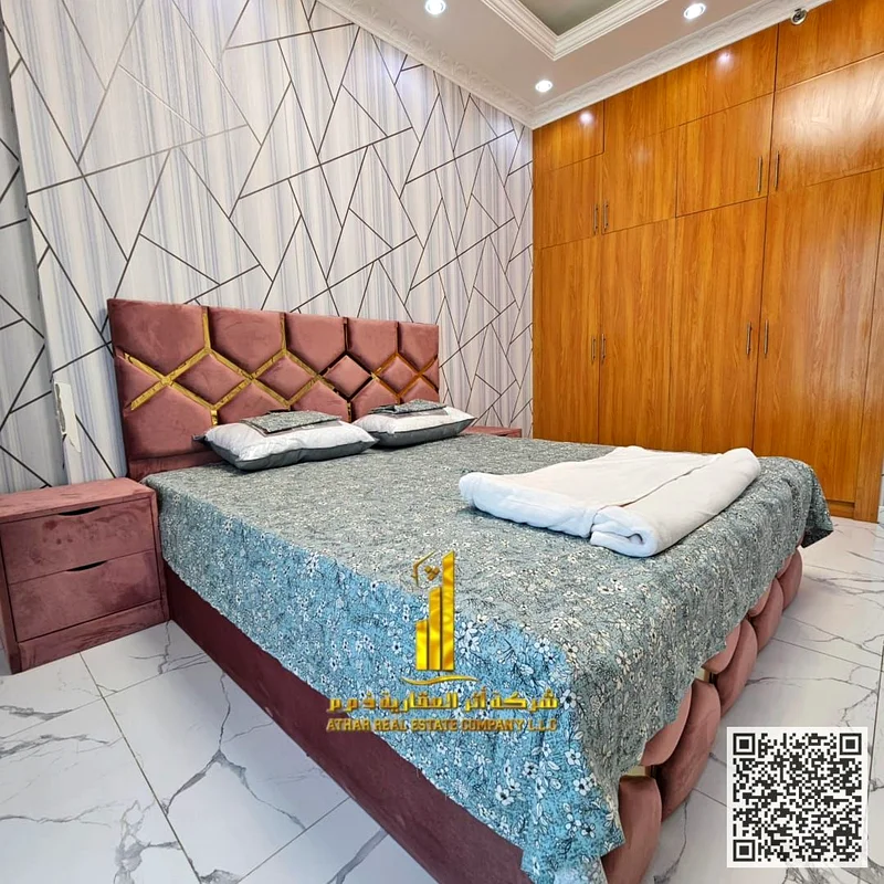 Luxurious two-bedroom apartment with a living room, open view, newly furnished, for monthly rent in Ajman - Al Rashidiya 1 - Oasis Towers63852458151043110
