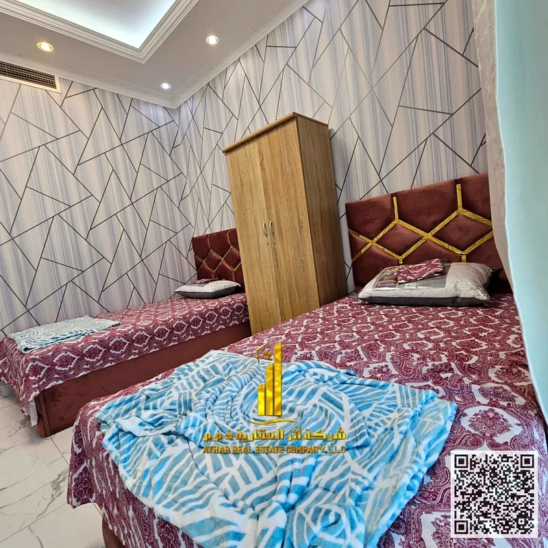 Luxurious two-bedroom apartment with a living room, open view, newly furnished, for monthly rent in Ajman - Al Rashidiya 1 - Oasis Towers63852458151043113