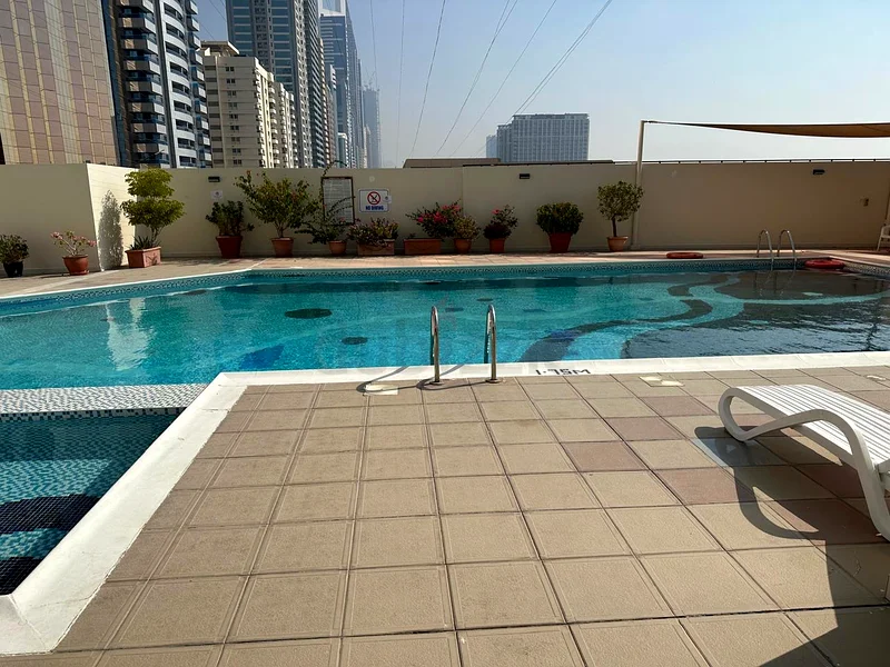 Furnished master room available for single lady next to Emirates tower metro @ 4000with dewa and net63795843962115110