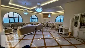 A fully furnished duplex apartment for sale with 4 master bedrooms over two floors, featuring a pano