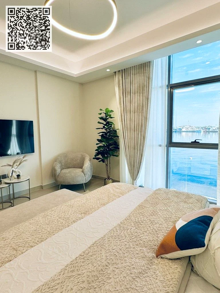 "حيث تلامس الأناقة خط الأفق – شقة فاخرة من غرفتي نوم في برج عجمان كريك"63874898474497114