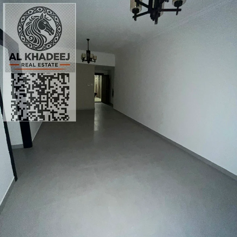 Two rooms and a hall with a balcony, large area, in the Al Hamidiya area, next to Etisalat and Ajman University, with a free month and free parking63709218307715113