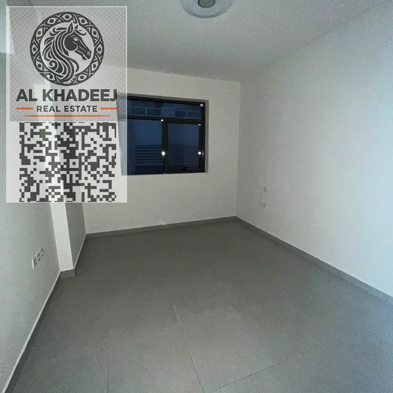 Two rooms and a hall with a balcony, large area, in the Al Hamidiya area, next to Etisalat and Ajman University, with a free month and free parking63709218307715112