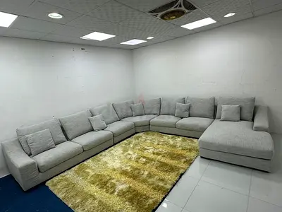 As perfect condition indigo feather filled Ushape sofa