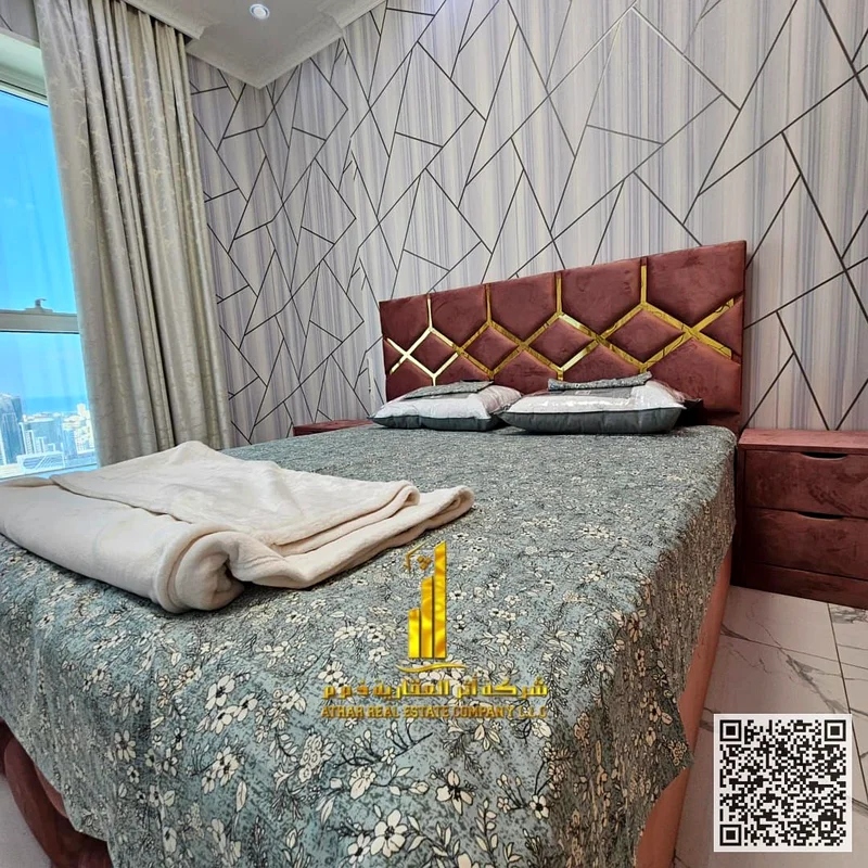 Luxurious two-bedroom apartment with a living room, open view, newly furnished, for monthly rent in Ajman - Al Rashidiya 1 - Oasis Towers63852579185921112