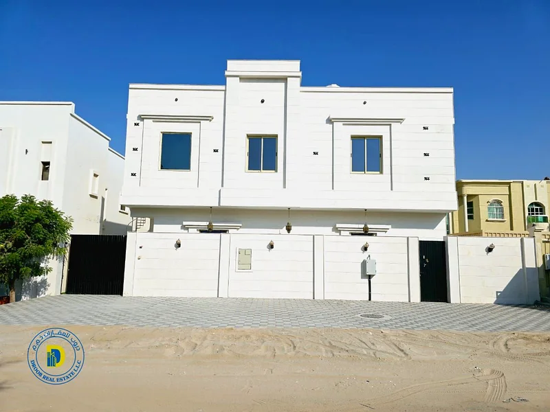 For sale, a Moroccan-style villa, Al Rawda 2, Ajman. The price includes water, electricity, air conditioning, and sewage.63879018682625114