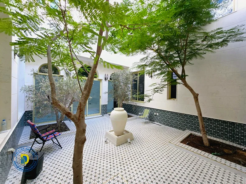 For sale, a Moroccan-style villa, Al Rawda 2, Ajman. The price includes water, electricity, air conditioning, and sewage.63879018682625111