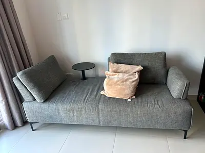 2-seater sofa bed with a side table