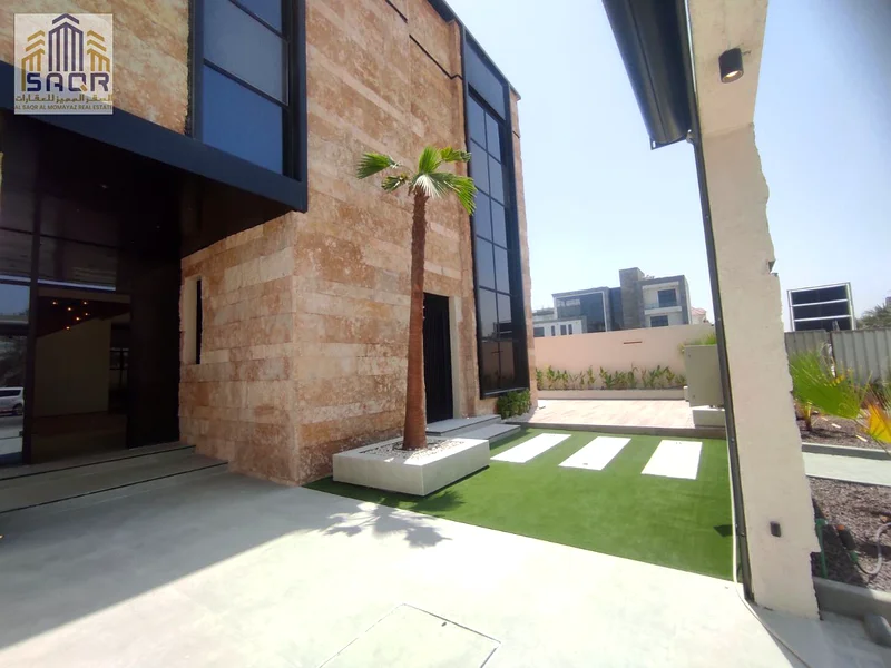For sale, a luxurious villa in Al Alia - Ajman | Two floors | Modern design | 5 master bedrooms | Majlis + 2 halls63873066949123110