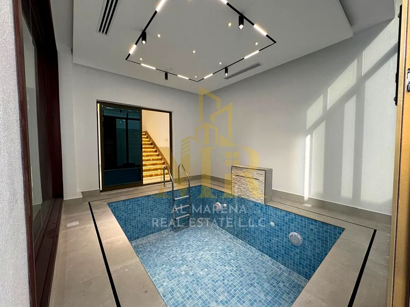 Modern designed villa with a private pool, two floors and a roof, freehold for life in a prime location in the heart of Ajman, including electricity a63907818296451111