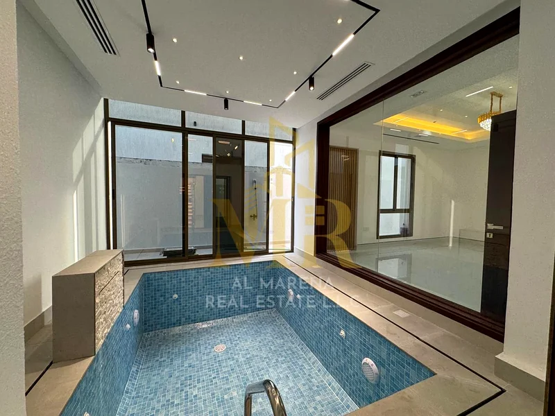 Modern designed villa with a private pool, two floors and a roof, freehold for life in a prime location in the heart of Ajman, including electricity a63907818296451110