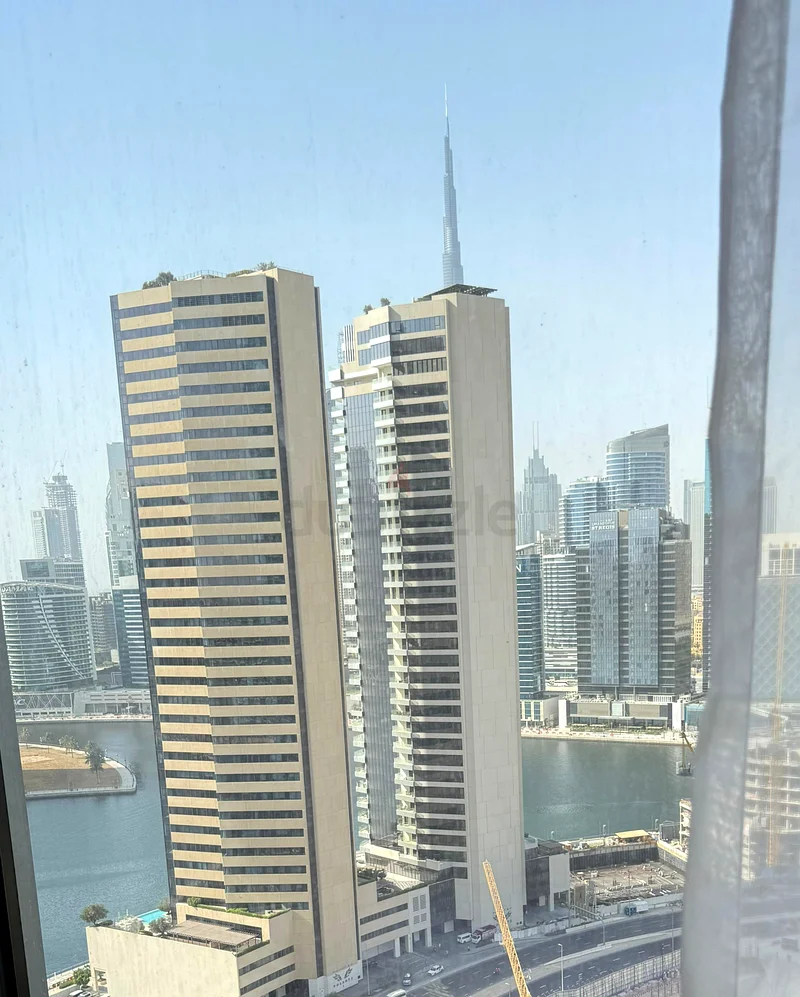 شقة جديدة بالكامل | طابق عالي | إطلالة على برج وخليج القناة | تشمل الفواتير63791563902209113