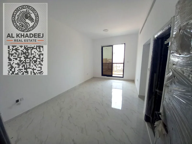 Two rooms and a hall with a large area and a balcony in Al Rawda 1 area, opposite Kanz Mall, easy access to Dubai and Sharjah63722169453571110