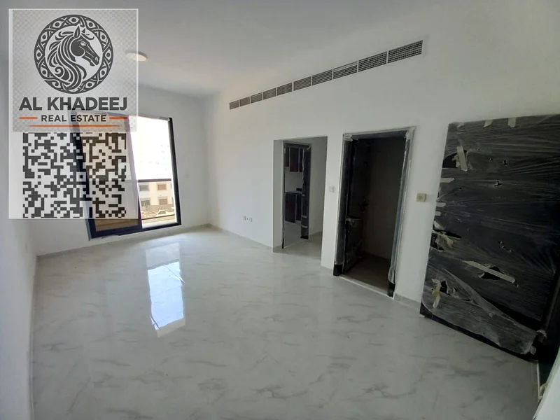 Two rooms and a hall with a large area and a balcony in Al Rawda 1 area, opposite Kanz Mall, easy access to Dubai and Sharjah63722169453571111