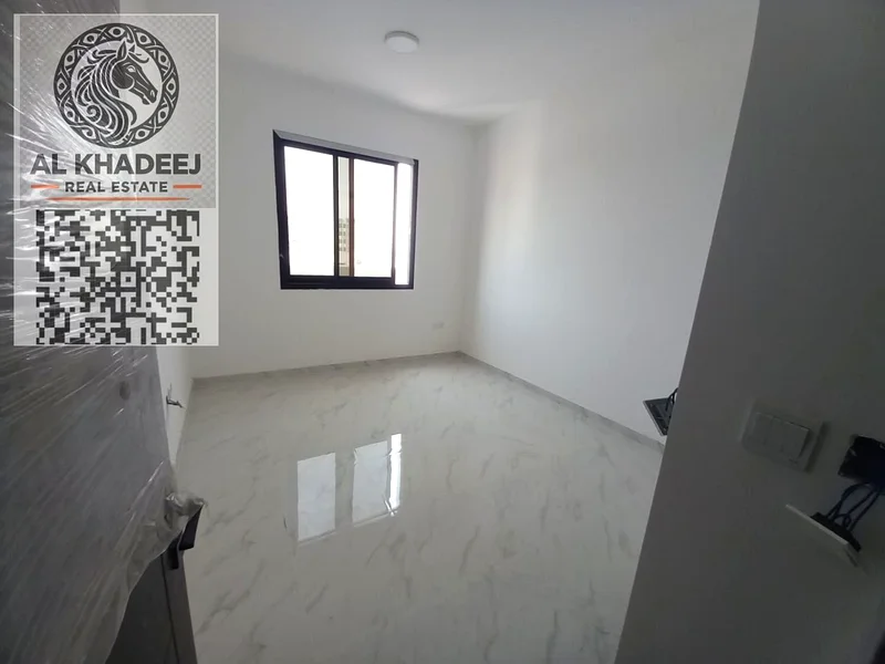 Two rooms and a hall with a large area and a balcony in Al Rawda 1 area, opposite Kanz Mall, easy access to Dubai and Sharjah63722169453571113