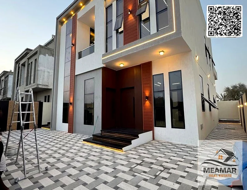 A luxurious, modern villa in Al Helio 1, featuring a stunning view and a spacious built-up area. The villa consists of two floors, ground and first, w63892471909634110