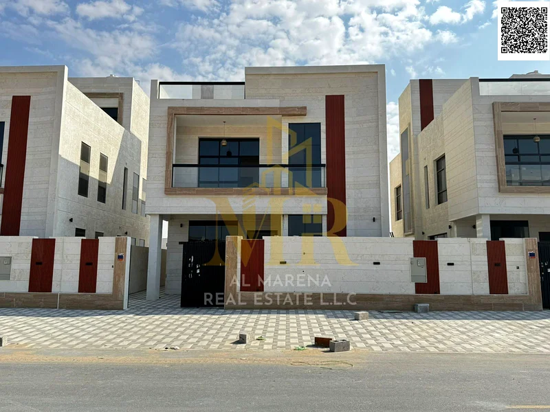 فيلا بسعر يشمل رسوم التسجيل ونقل الملكية على الشارع الرئيسي، جاهزة للسكن في أكثر مناطق عجمان رقيًا. ملكية حرة63883359749889110