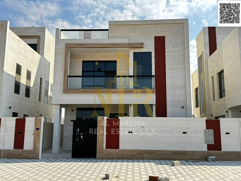 فيلا بسعر يشمل رسوم التسجيل ونقل الملكية على الشارع الرئيسي، جاهزة للسكن في أكثر مناطق عجمان رقيًا. ملكية حرة63883359749889112