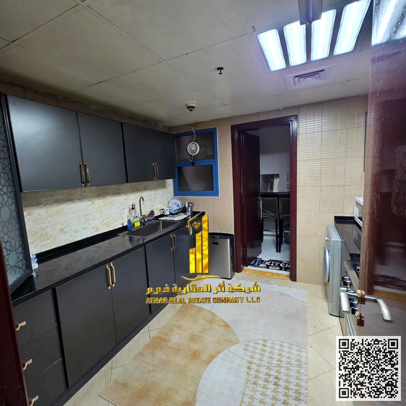 For monthly rent in Ajman - two-bedroom apartment with a balcony, a distinctive open view, fully furnished with elegant furniture, and a fully equippe63838584321667114