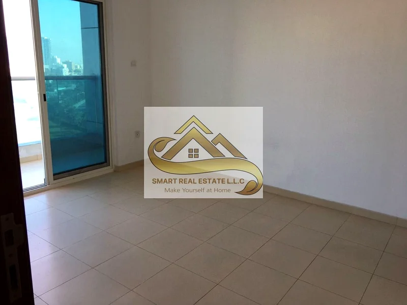 2 bedrooms and a large hall for sale in City Towers Ajman with three bathrooms and a large separate kitchen and balcony with beautiful view63891129268097114