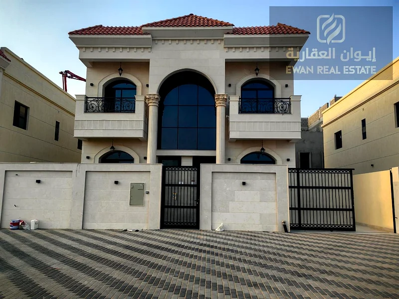 For Sale | Luxurious corner villa in Al Helio, Ajman, super deluxe finishing + private pool, prime location: - Near the exits from Sharjah and Dubai .63909116861443110
