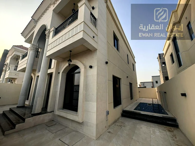 For Sale | Luxurious corner villa in Al Helio, Ajman, super deluxe finishing + private pool, prime location: - Near the exits from Sharjah and Dubai .63909116861443114