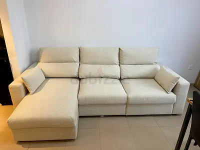 Beige Ikea Eskilstuna L shape sofa bed with storage