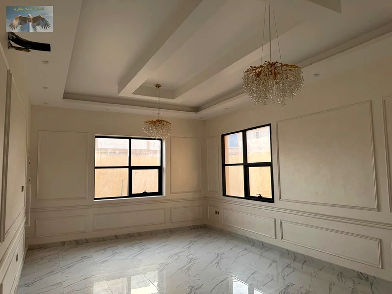 Villa for sale in Ajman, prime location close to all services. Super deluxe finish, 5 master bedrooms, hall, majlis, equipped kitchen, and maid room.63877166381827112