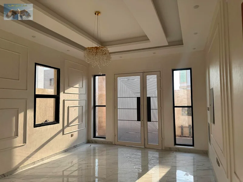 Villa for sale in Ajman, prime location close to all services. Super deluxe finish, 5 master bedrooms, hall, majlis, equipped kitchen, and maid room.63877166381827111