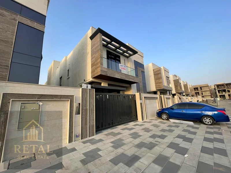 Luxury villa for sale in Ajman, Al Bahia area – 5 master bedrooms, majlis, living room, fitted kitchen, maid’s room, central AC, super deluxe finish63882823548035111