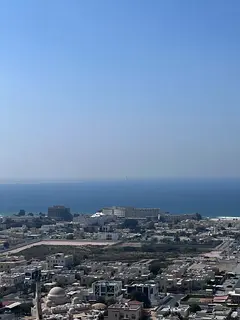 Four-bedroom apartment with a living room and maid's room for annual rent in Al Majaz 3, with a 