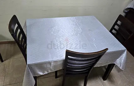 Stylish Wooden Dining Table with Elegant Tablecloth